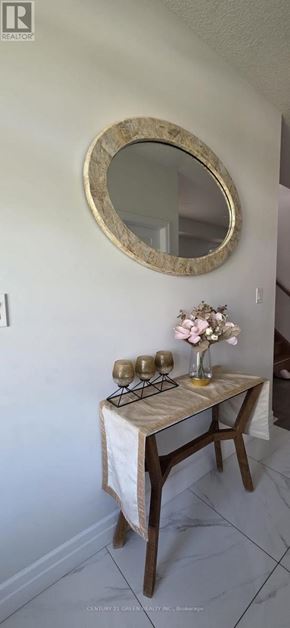 London South (South U) apartment for rent - A table with a vase of flowers and two candles on it.