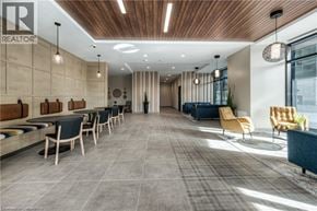 Kitchener condo for rent - A modern office space with a long table and chairs.
