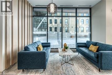 Kitchener condo for rent - A living room with two couches and a coffee table.