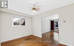 Toronto (Highland Creek) apartment for rent - A room with a ceiling fan and a window.