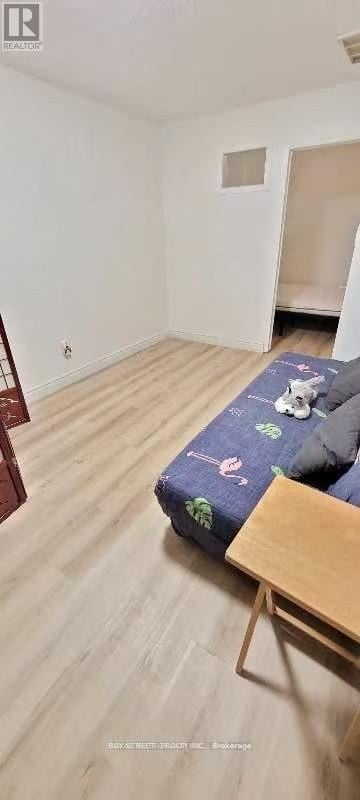 Toronto (Pleasant View) townhouse for rent - A bedroom with a bed and a wooden table.