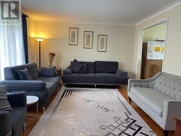 Markham (Bullock) apartment for rent - A living room with a grey sofa set and a rug.