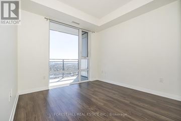 Toronto (Henry Farm) condo for rent - A room with a sliding glass door leading to a balcony.
