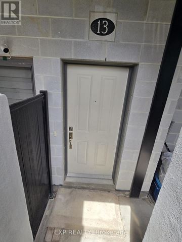 Cambridge townhouse for rent - A white door with a black handle is on the 13th floor of a building.