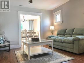 Niagara Falls (Hospital) apartment for rent - A living room with a couch, chair, and coffee table.