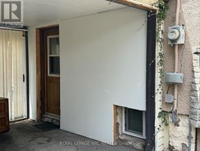 Niagara Falls (Hospital) apartment for rent - A white wall with a door and a window.