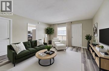 London apartment for rent - A living room with a green couch and a coffee table.