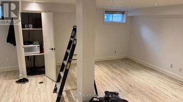 Toronto (Broadview North) apartment for rent - A room with a ladder and a pair of shoes on the floor.