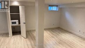 Toronto (Broadview North) apartment for rent - A room with a microwave and a window.