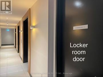 Toronto (Bay Street Corridor) condo for rent - A hallway with a sign that says locker room door.