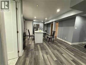 Kitchener apartment for rent - A room with a wooden floor and a white cabinet.