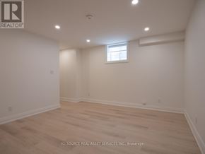 Toronto (Junction Area) apartment for rent - A room with a window and wooden flooring.