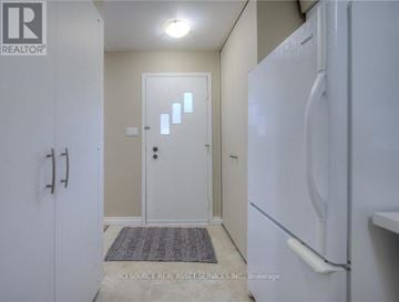 Waterloo apartment for rent - A white refrigerator in a kitchen with a door open.