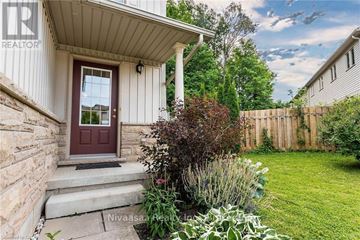 Waterloo townhouse for rent - A house with a red door and a white wall.