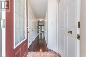Waterloo townhouse for rent - A hallway with white doors and a red door on the left.