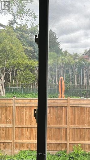 Toronto (Bayview Woods-Steeles) apartment for rent - A wooden fence with a gate in the middle.
