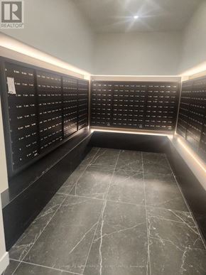 Toronto (Church-Yonge Corridor) condo for rent - A black and white image of a room with a list of names on the wall.