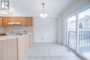Markham (Berczy) apartment for rent - A kitchen with wooden cabinets and a white countertop.