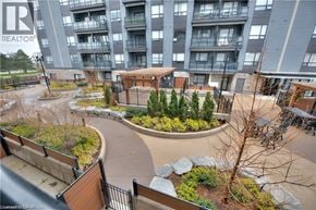 Waterloo condo for rent - A realtor photo of apartment buildings with a landscaped courtyard.