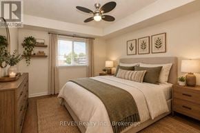 Welland (Prince Charles) condo for rent - A bedroom with a large bed, a ceiling fan, and a window with curtains.