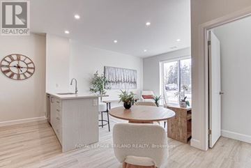 St. Thomas apartment for rent - A well-lit kitchen with a dining table and chairs.