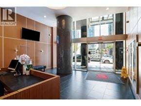 Vancouver apartment for rent - A reception area with a wooden wall and a black counter.