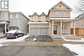 Ajax (Central East) apartment for rent - A house with a car parked in front of it.
