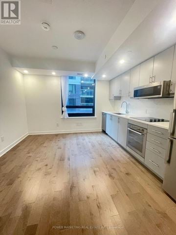 Ottawa condo for rent - A well-lit kitchen with wooden flooring and modern appliances.