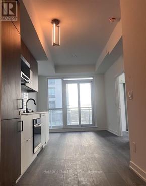 Richmond Hill (South Richvale) condo for rent - A well-lit, modern kitchen with a view of the city outside the window.