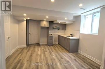 Niagara Falls (Forestview) apartment for rent - A kitchen area with wooden flooring and a countertop.