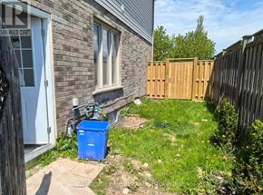 Niagara Falls (Forestview) apartment for rent - A blue recycling bin sits in front of a house.