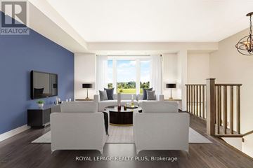 Guelph (Grange Road) townhouse for rent - A living room with a grey sofa set and a television.