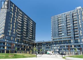 Burlington (Alton) condo for rent - Two modern apartment buildings with balconies and a clear blue sky.