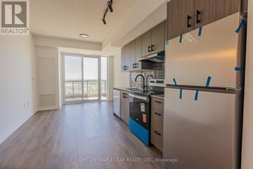 Burlington (Alton) condo for rent - A kitchen with a refrigerator, oven, and dishwasher is for sale.