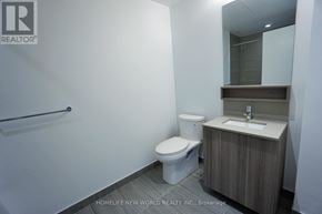 Vaughan (Vaughan Corporate Centre) condo for rent - A small bathroom with a toilet, sink and mirror.