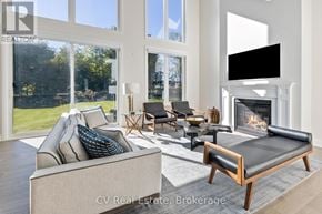 Blue Mountains apartment for rent - A living room with a couch, chairs, and a fireplace.