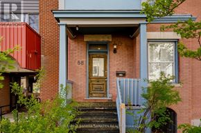 Ottawa multi-family for rent - A red brick house with a blue trim and a wooden door.