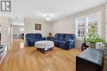 Mississauga (Churchill Meadows) apartment for rent - A living room with a table and two chairs.