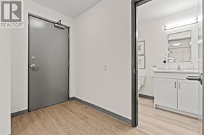 Thorold (Thorold Downtown) multi-family for rent - A bathroom with a sink, mirror, and a door.