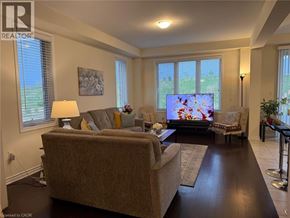 Cambridge apartment for rent - A living room with a couch, a chair, a television, and a painting on the wall.