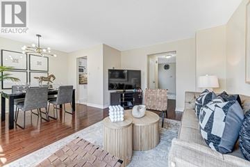Markham (Aileen-Willowbrook) townhouse for rent - A living room with a grey couch and a fireplace.