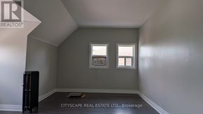 Hamilton (Blakeley) apartment for rent - A room with a window and a radiator on the floor.