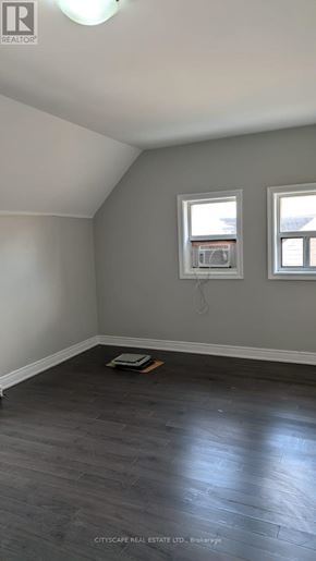 Hamilton (Blakeley) apartment for rent - A room with grey walls and a window with a white frame.