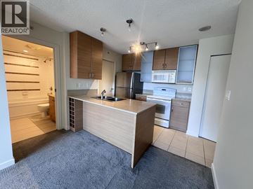 Vancouver apartment for rent - A kitchen with a counter and cabinets.