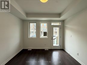 Markham townhouse for rent - A room with a view of buildings outside the window.
