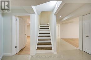 Markham (Milliken Mills East) apartment for rent - A hallway with a staircase leading to the second floor.