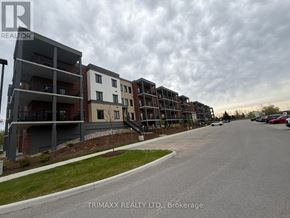 Clearview (Creemore) condo for rent - A row of modern apartment buildings with a cloudy sky in the background.