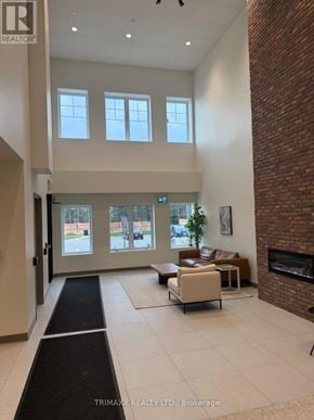 Clearview (Creemore) condo for rent - A realtor's office with a brick wall and a fireplace.