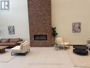 Clearview (Creemore) condo for rent - A living room with a fireplace and a couch.