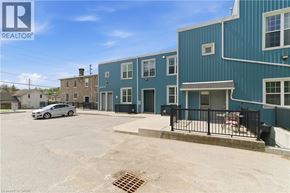 Cambridge apartment for rent - A blue building with a car parked in front of it.